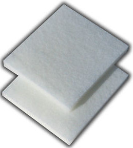 Two square white pulp filter pads showing sheet thickness